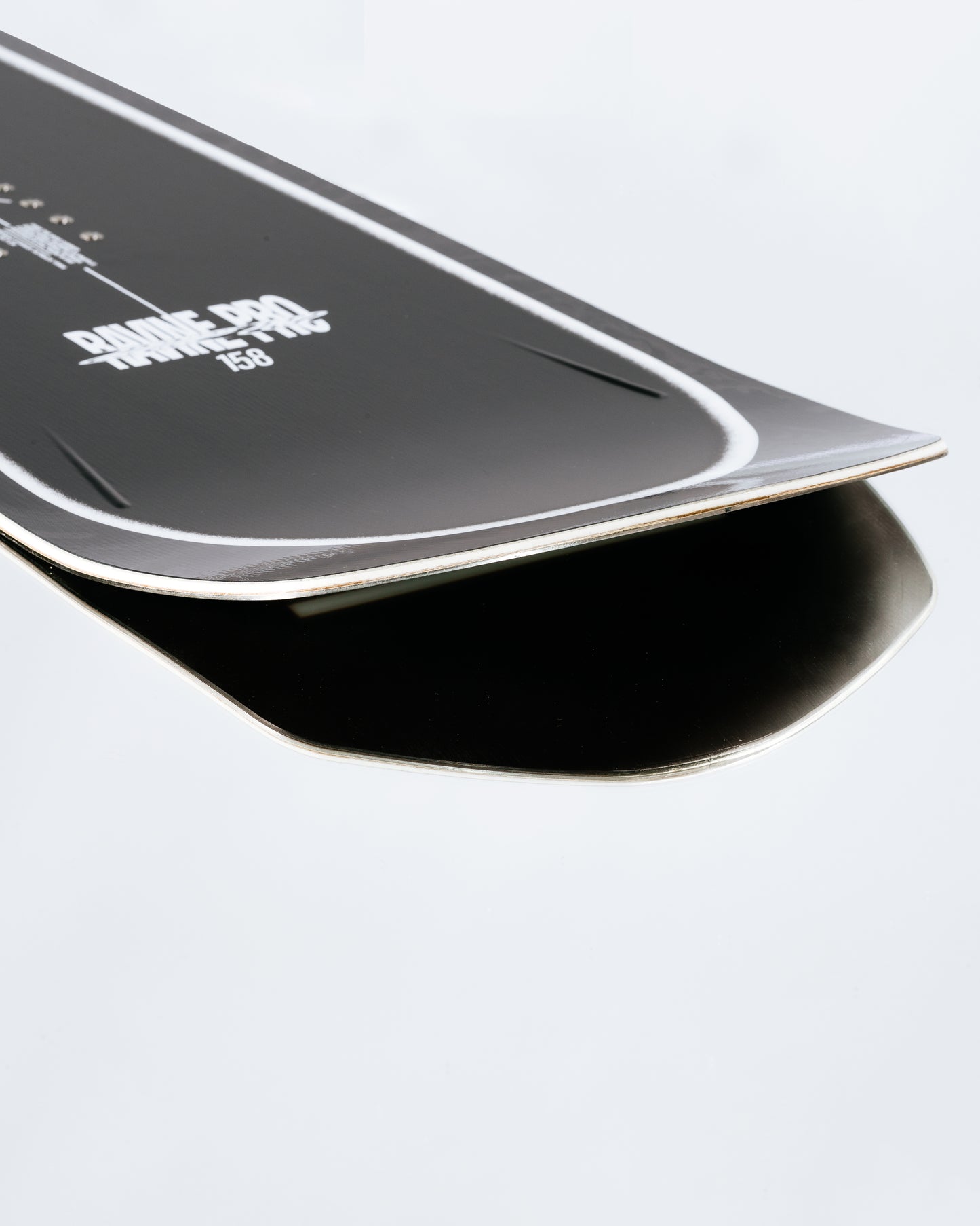 The tail and base of the powder snowboard with HotRods and SinterSpeed base. Ravine Pro 2025 | Rome Snowboards™