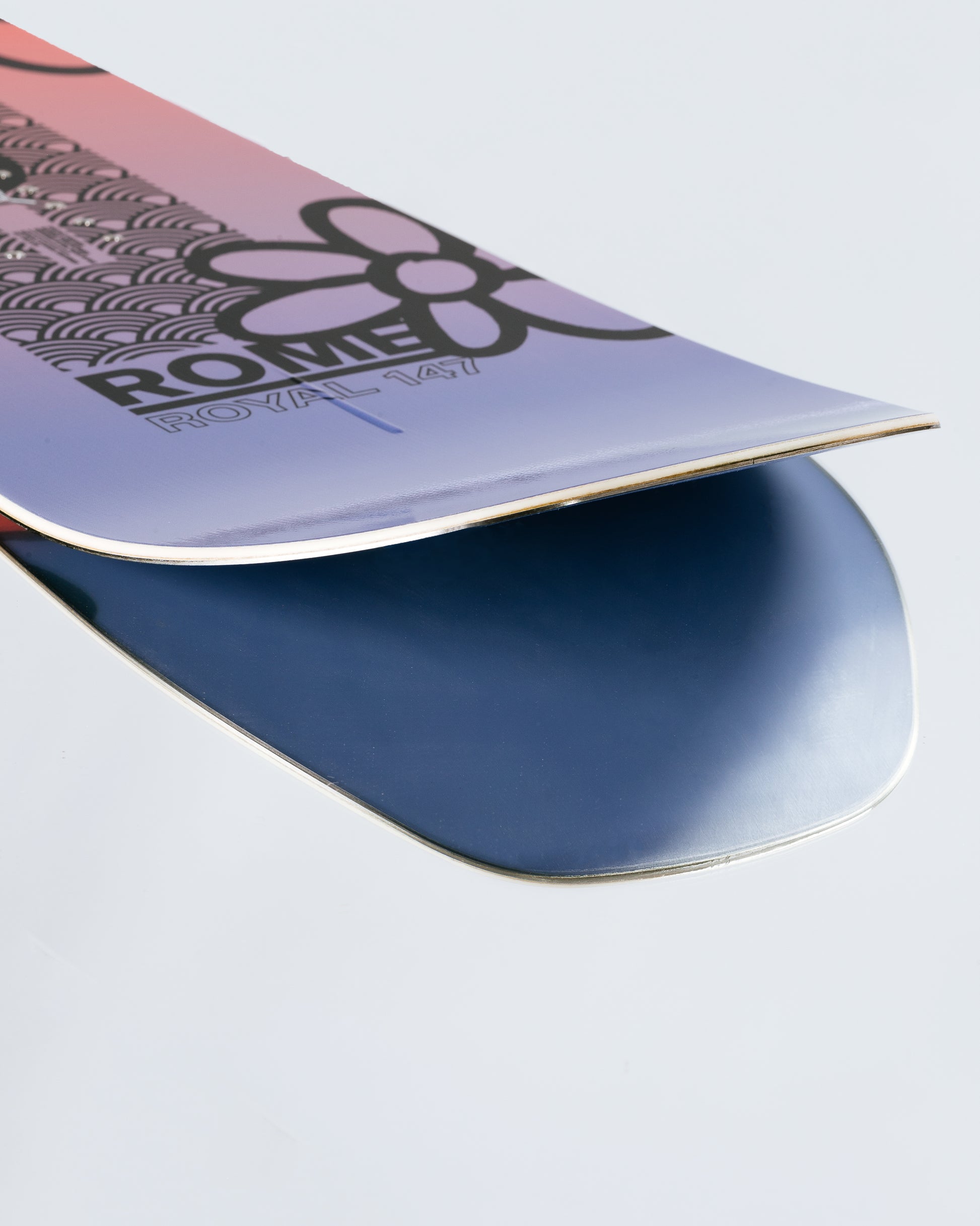 The tail and base of the freeride womens snowboard with HotRods and Impact base. Royal 2025 | Rome Snowboards™ 2025.