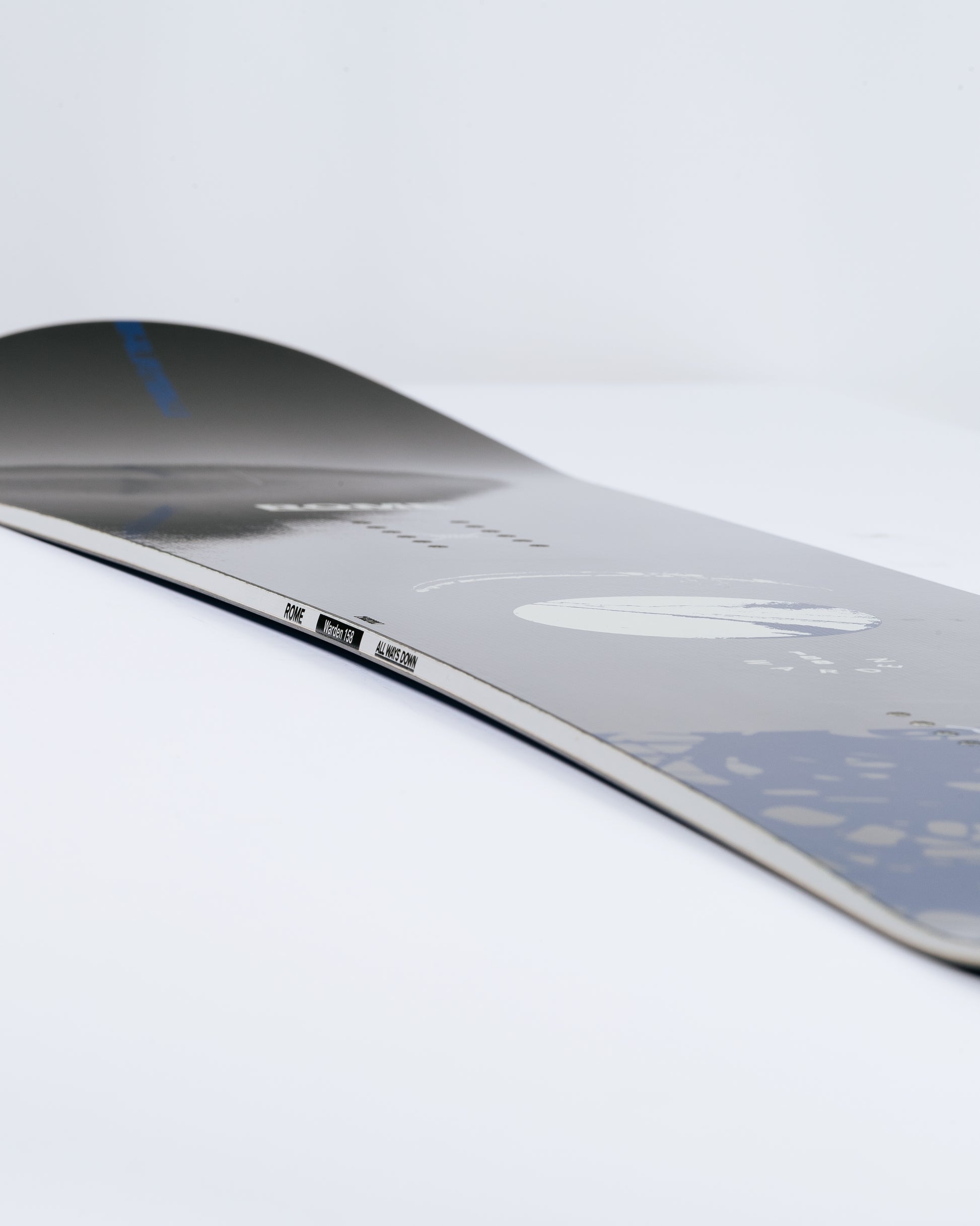 Photograph showing freeride snowboard with fusion camber. Warden 2025 | Rome Snowboards™ 2025.